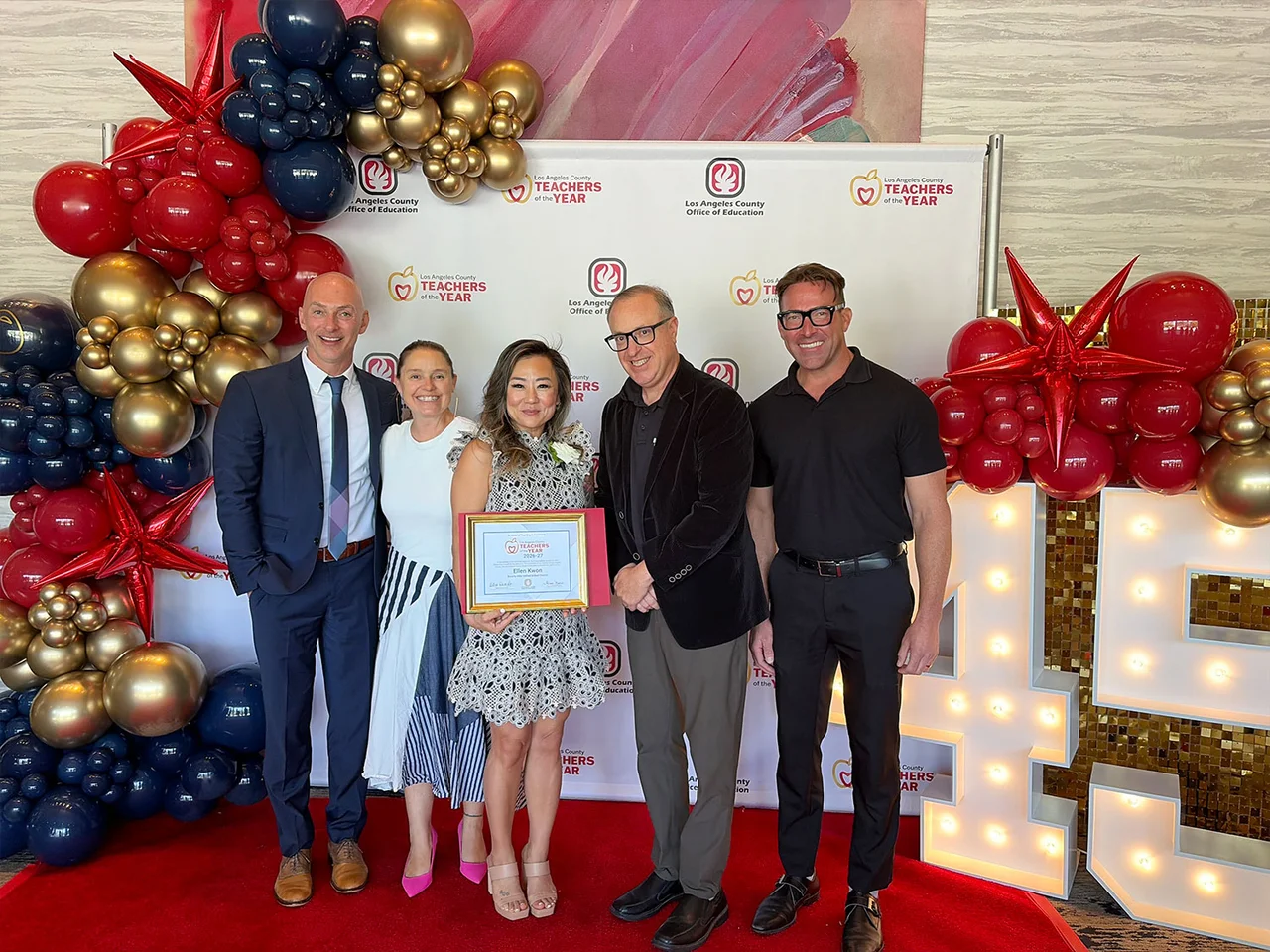 Kwon (center) was honored by LACOE.
